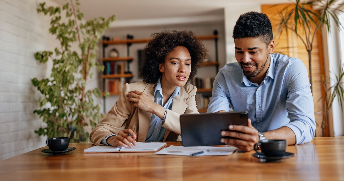 Two people looking at tablet