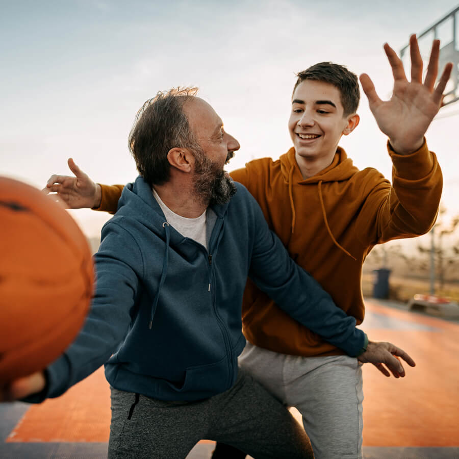 family playing basketball